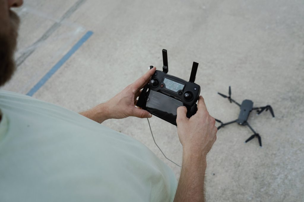 Drone pilot holding controller